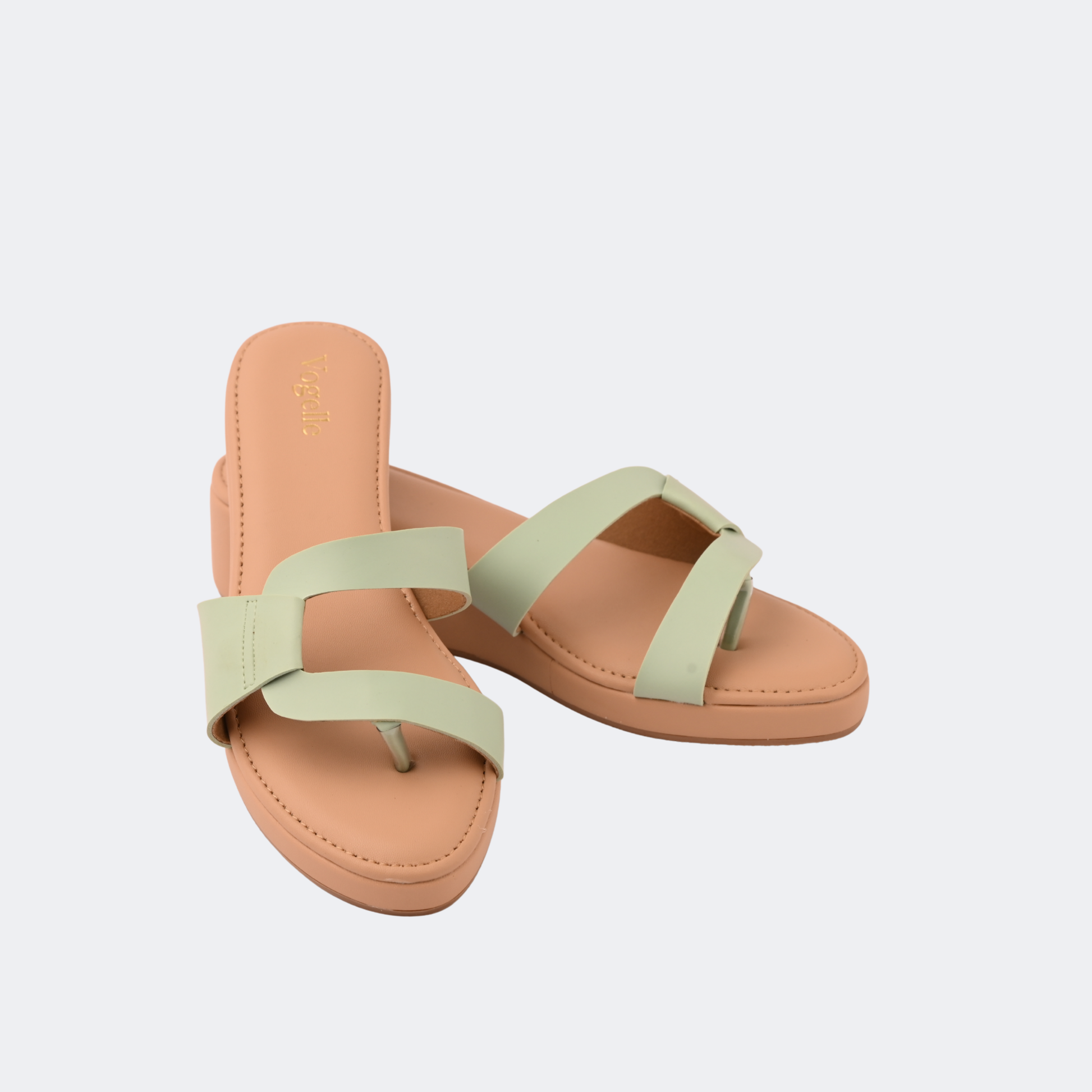 Pair of tan sandals with light green straps on a white background | Vogelle